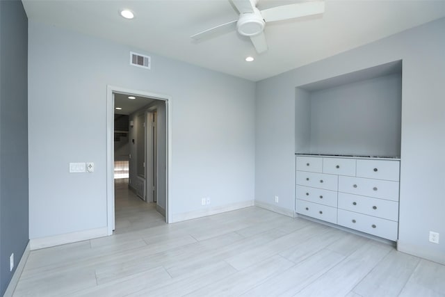 unfurnished bedroom with light wood-style flooring, visible vents, baseboards, and recessed lighting