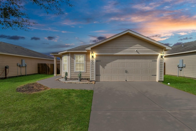 single story home featuring a garage, driveway, and a yard