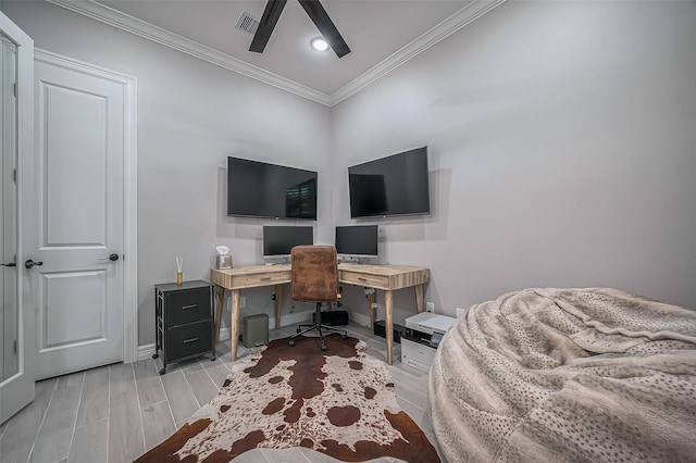 office featuring ceiling fan, wood finish floors, visible vents, baseboards, and crown molding