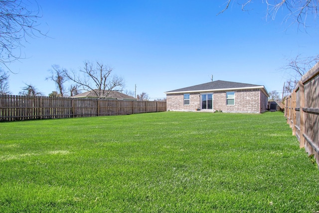 view of yard featuring a fenced backyard