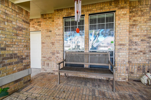 interior space with a garage and a porch