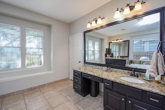 full bathroom featuring tile patterned flooring, a healthy amount of sunlight, a garden tub, and baseboards