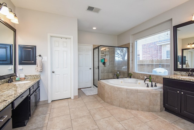 full bathroom with a shower stall, visible vents, a garden tub, and a sink