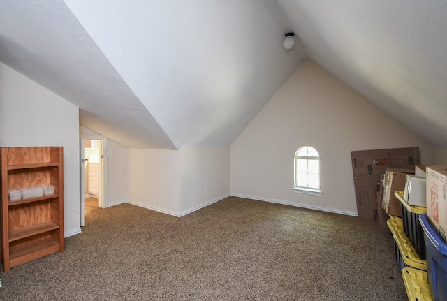 bonus room featuring vaulted ceiling, baseboards, and carpet