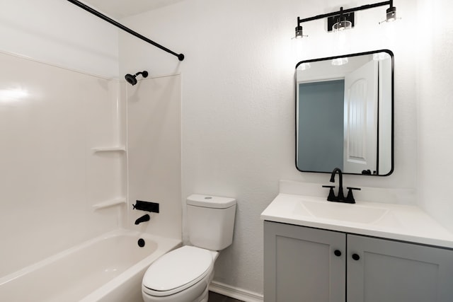 full bathroom with  shower combination, vanity, and toilet