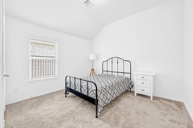 carpeted bedroom with visible vents, baseboards, and lofted ceiling