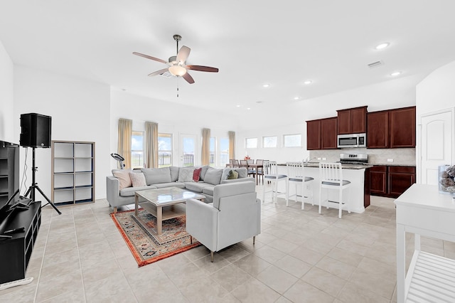 living room with light tile patterned floors, recessed lighting, visible vents, and ceiling fan