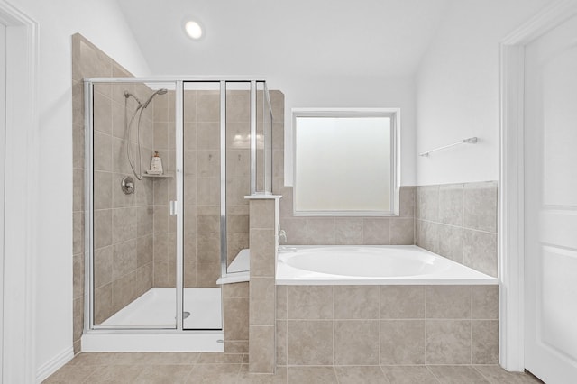 full bathroom with tile patterned floors, a bath, and a stall shower