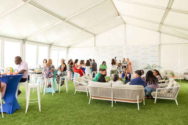 interior space featuring outdoor lounge area and a lawn