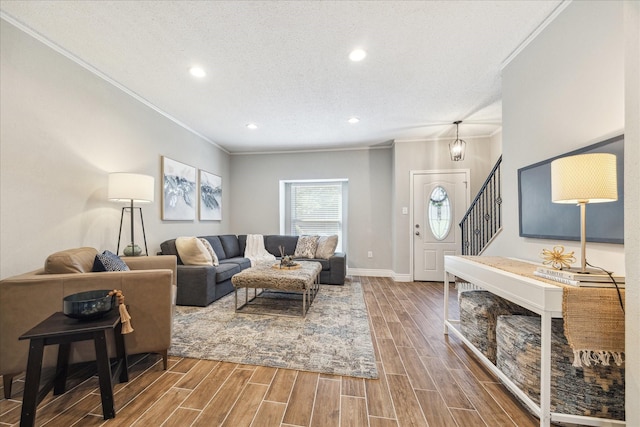 living room with recessed lighting, wood finish floors, baseboards, stairway, and crown molding