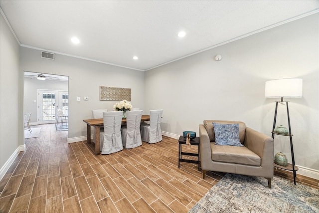 dining area featuring french doors, visible vents, ornamental molding, wood tiled floor, and baseboards