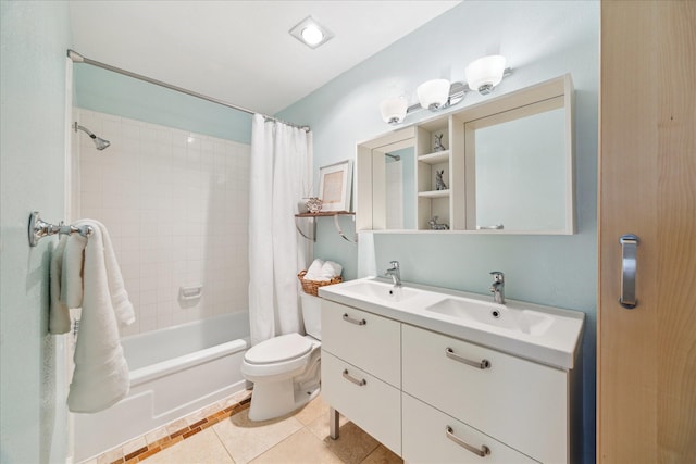 full bathroom featuring shower / bath combination with curtain, vanity, tile patterned flooring, and toilet