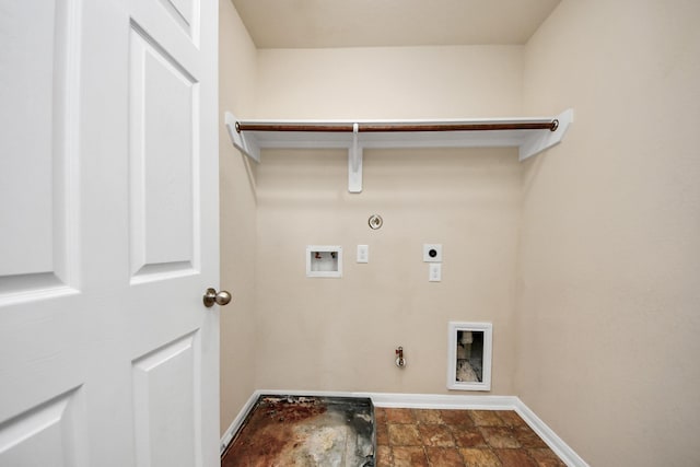 clothes washing area with laundry area, baseboards, gas dryer hookup, hookup for a washing machine, and hookup for an electric dryer