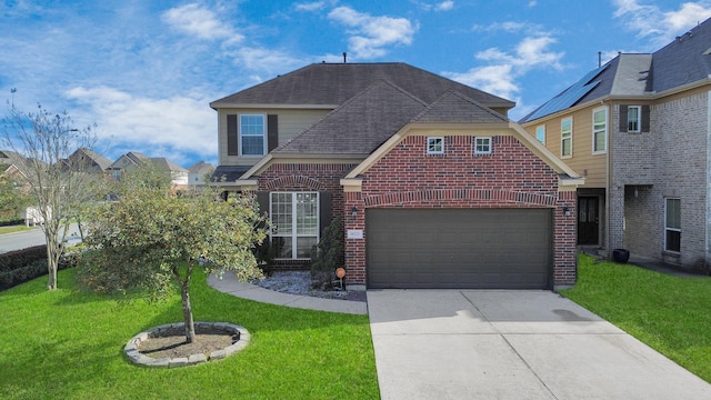 view of front of home featuring a shingled roof, a front yard, concrete driveway, and brick siding