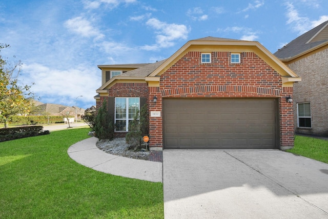 view of front of home with an attached garage, concrete driveway, brick siding, and a front yard