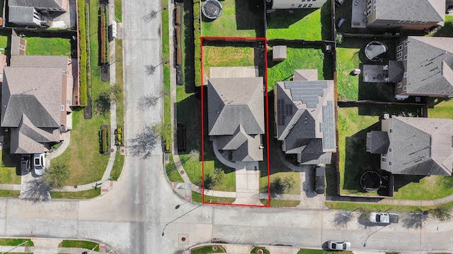 birds eye view of property with a residential view