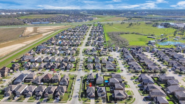 aerial view with a water view and a residential view