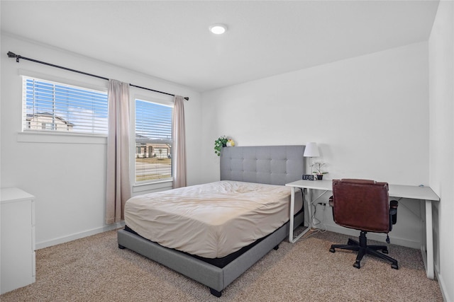 carpeted bedroom with baseboards