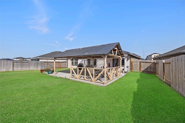 rear view of house featuring metal roof