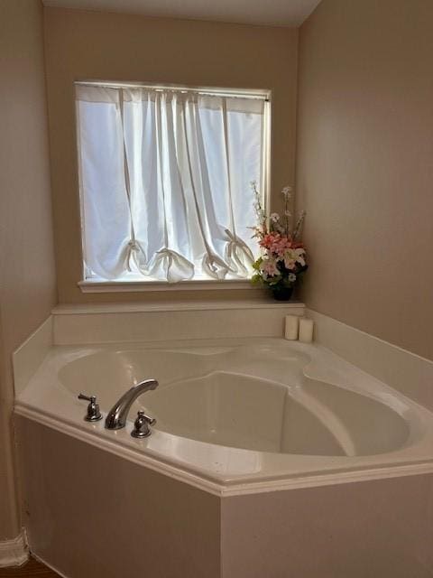 bathroom featuring a garden tub