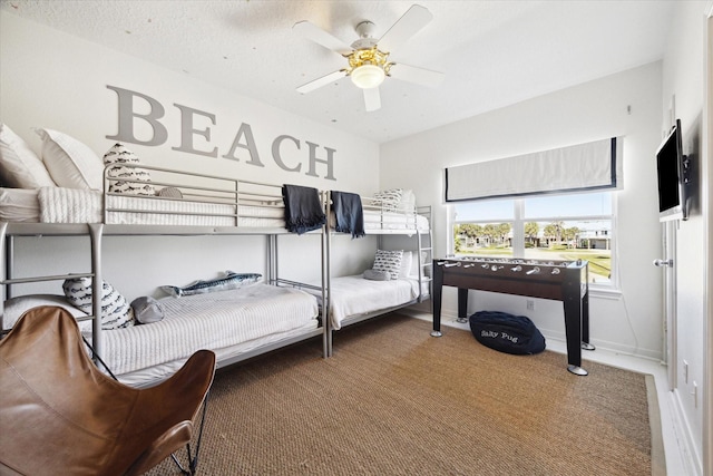 bedroom featuring a ceiling fan and baseboards