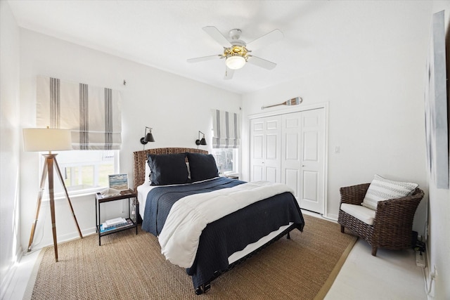 bedroom featuring ceiling fan and a closet