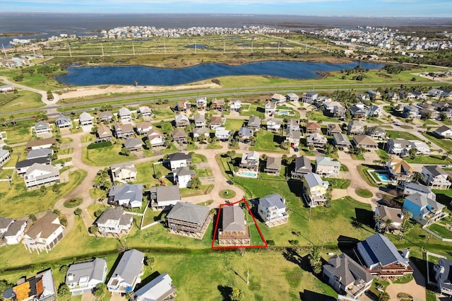 bird's eye view featuring a water view and a residential view