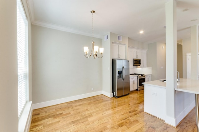 kitchen featuring stainless steel appliances, visible vents, baseboards, white cabinetry, and light wood-style floors