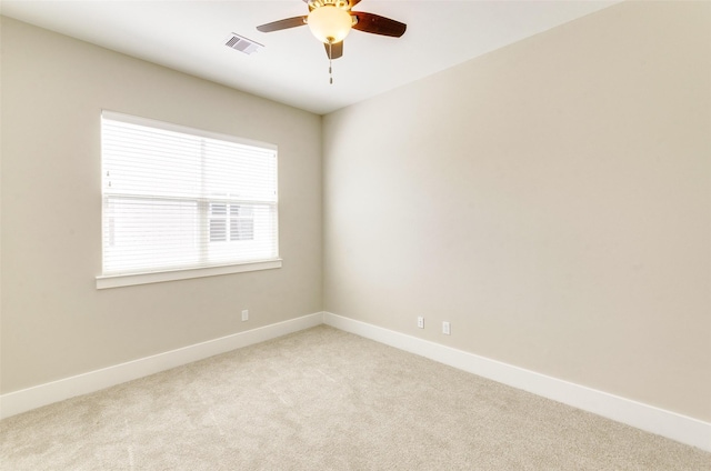 unfurnished room with visible vents, baseboards, ceiling fan, and carpet flooring