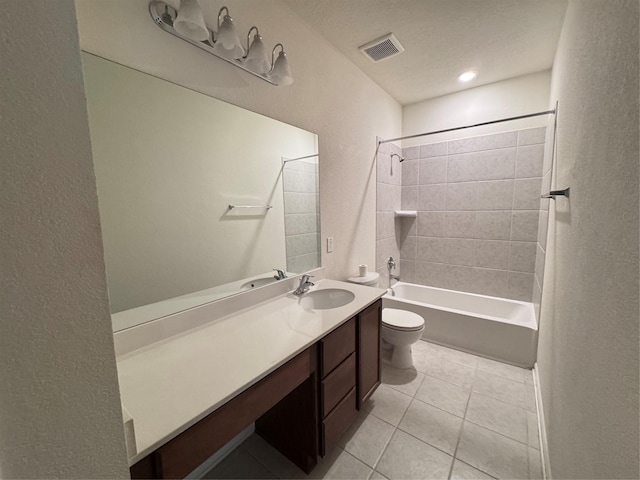 full bathroom with visible vents, toilet, vanity,  shower combination, and tile patterned flooring