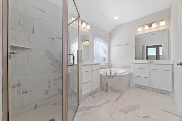 full bath featuring a garden tub, two vanities, vaulted ceiling, marble finish floor, and a shower stall