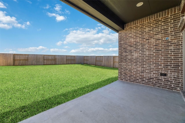 view of yard featuring a patio and a fenced backyard