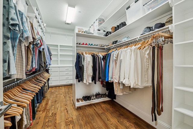 spacious closet with wood finished floors