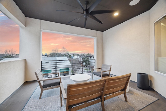 balcony at dusk with a ceiling fan