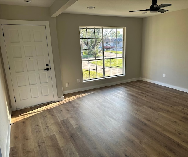 entrance foyer featuring a ceiling fan, baseboards, and wood finished floors