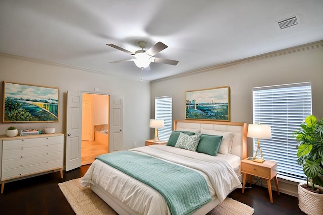 bedroom with dark wood finished floors, visible vents, ornamental molding, a ceiling fan, and multiple windows