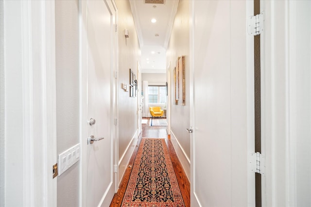 hallway with baseboards, ornamental molding, dark wood-style flooring, and recessed lighting