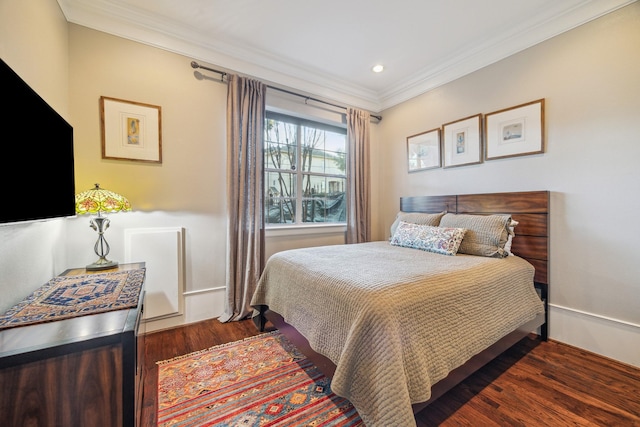 bedroom with crown molding, wood finished floors, and recessed lighting