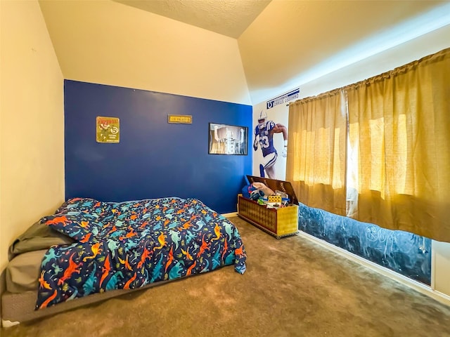 carpeted bedroom featuring vaulted ceiling