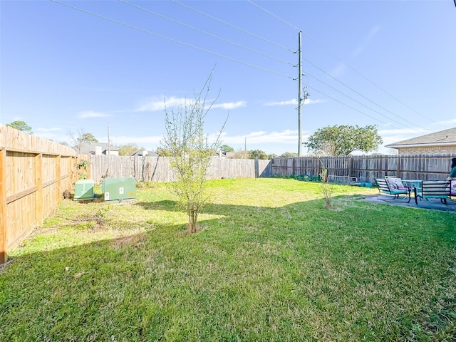 view of yard featuring a fenced backyard