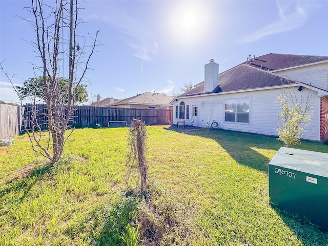 view of yard featuring a fenced backyard