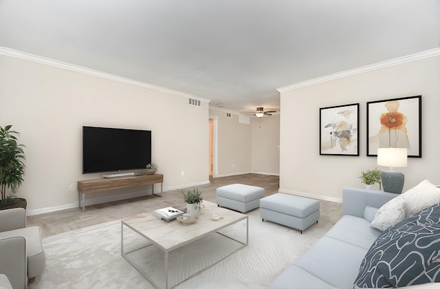 living area with visible vents, ornamental molding, a ceiling fan, wood finished floors, and baseboards