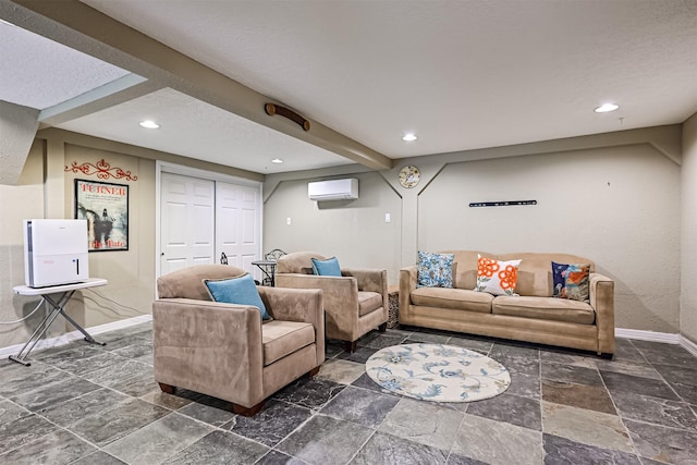 living area featuring an AC wall unit, recessed lighting, and baseboards