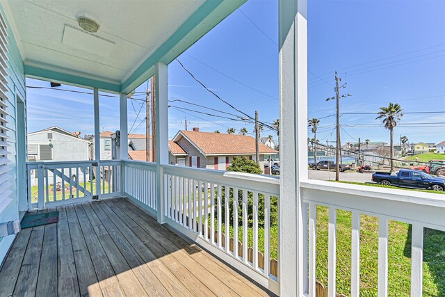 wooden deck with a residential view