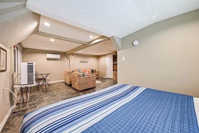 bedroom featuring recessed lighting, a wall mounted air conditioner, a textured ceiling, and baseboards