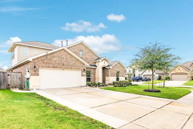 traditional-style house with a garage, brick siding, fence, concrete driveway, and a front yard