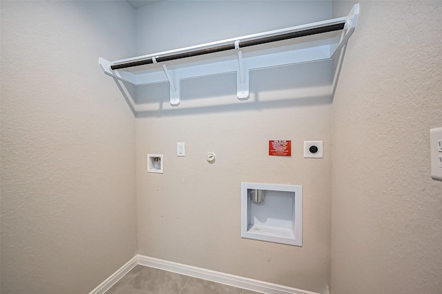 laundry area featuring gas dryer hookup, hookup for a washing machine, hookup for an electric dryer, laundry area, and baseboards