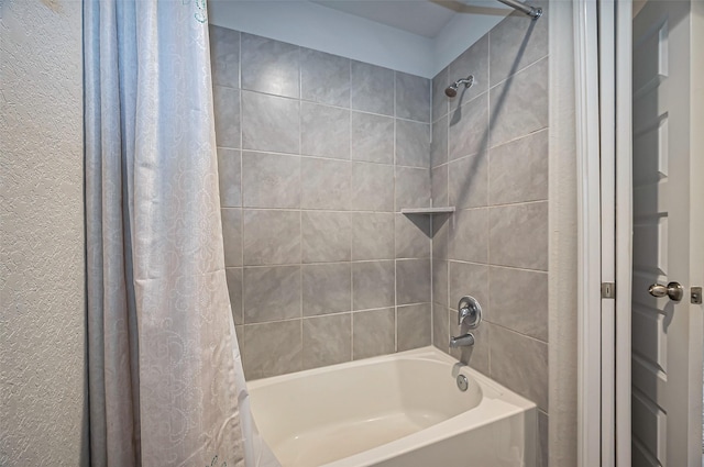 bathroom with shower / bath combination with curtain