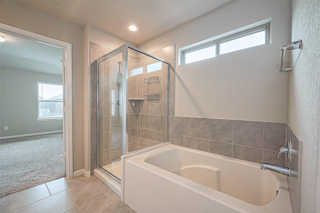 full bathroom with a stall shower, tile patterned flooring, recessed lighting, and a bath