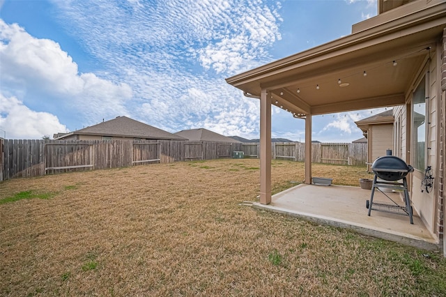 view of yard with a fenced backyard and a patio